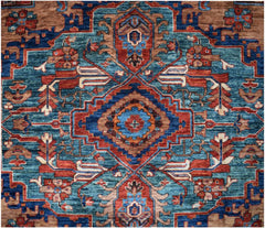 Handmade Afghan Chobi rug featuring a bold geometric medallion in blue, red, and brown tones.