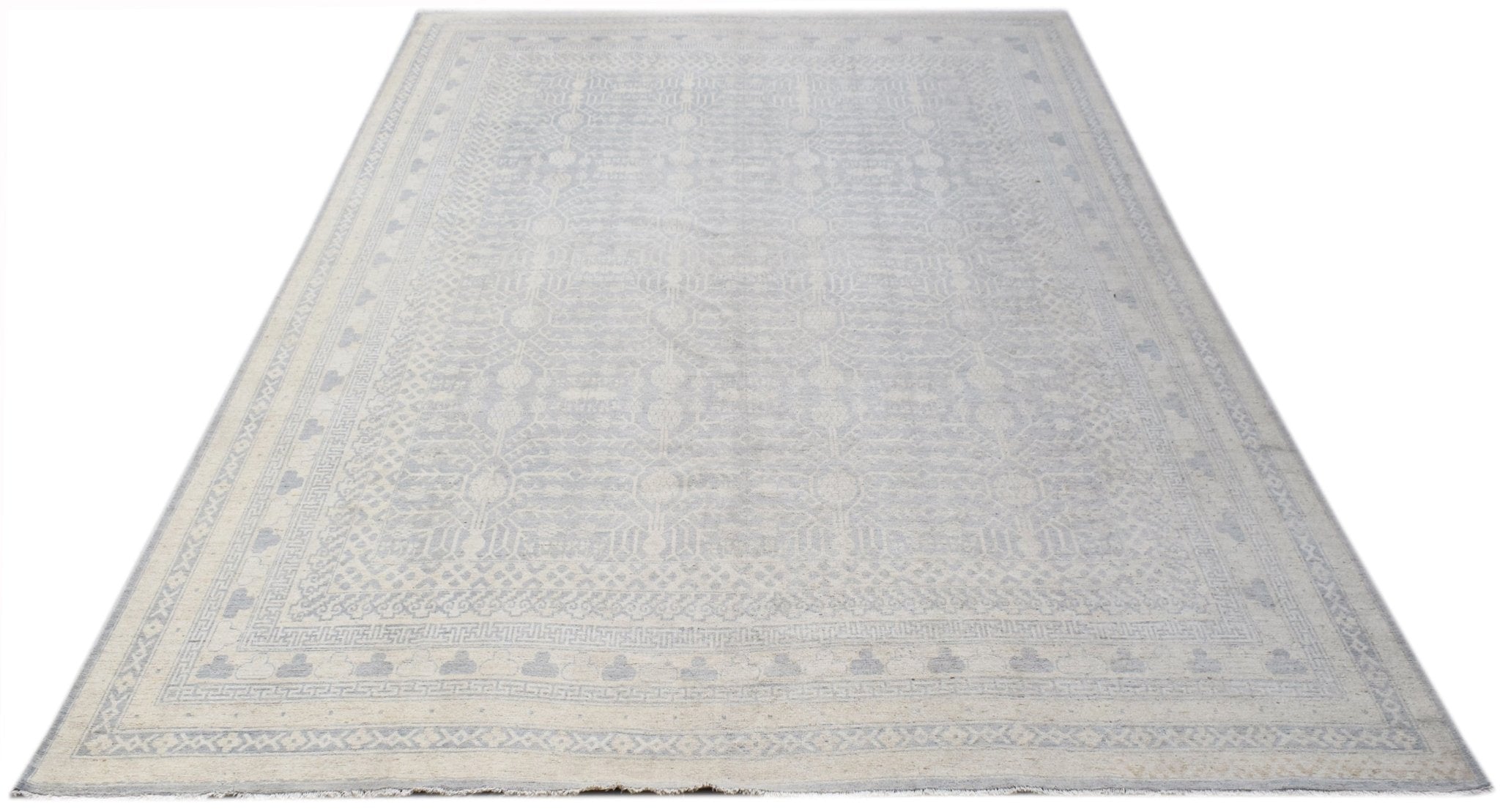 A handwoven Afghan Chobi rug featuring a light grey and cream Khotan pattern.