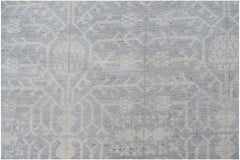 A handwoven Afghan Chobi rug featuring a light blue and cream traditional Khotan pattern.