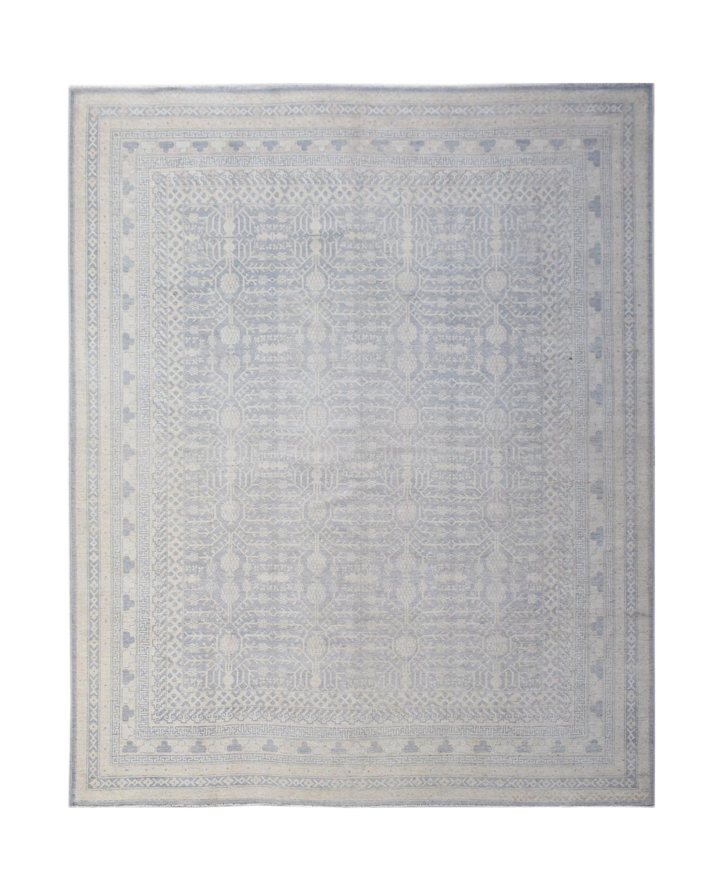 An Afghan Chobi rug featuring a light blue and cream geometric Khotan pattern.