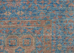 A close-up of a handwoven Afghan Chobi rug featuring a detailed Mamluk pattern in blue and tan.