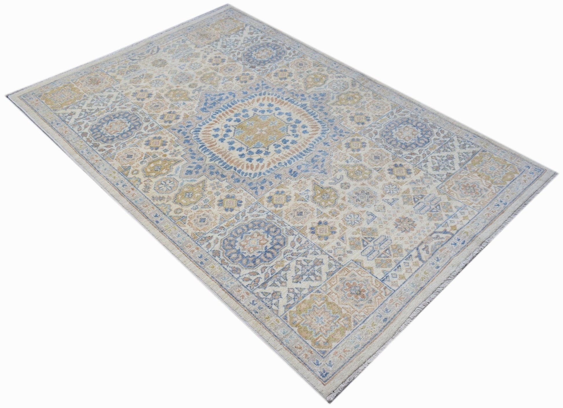 Handwoven Afghan Chobi rug featuring a traditional Mamluk medallion pattern in blue and gold.