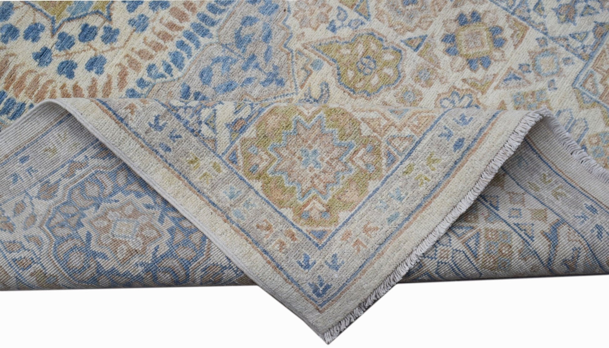 A handwoven Afghan Chobi rug featuring a traditional Mamluk medallion pattern in blue and tan.