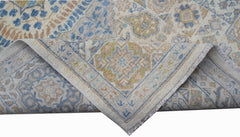 A handwoven Afghan Chobi rug featuring a traditional Mamluk medallion pattern in blue and tan.