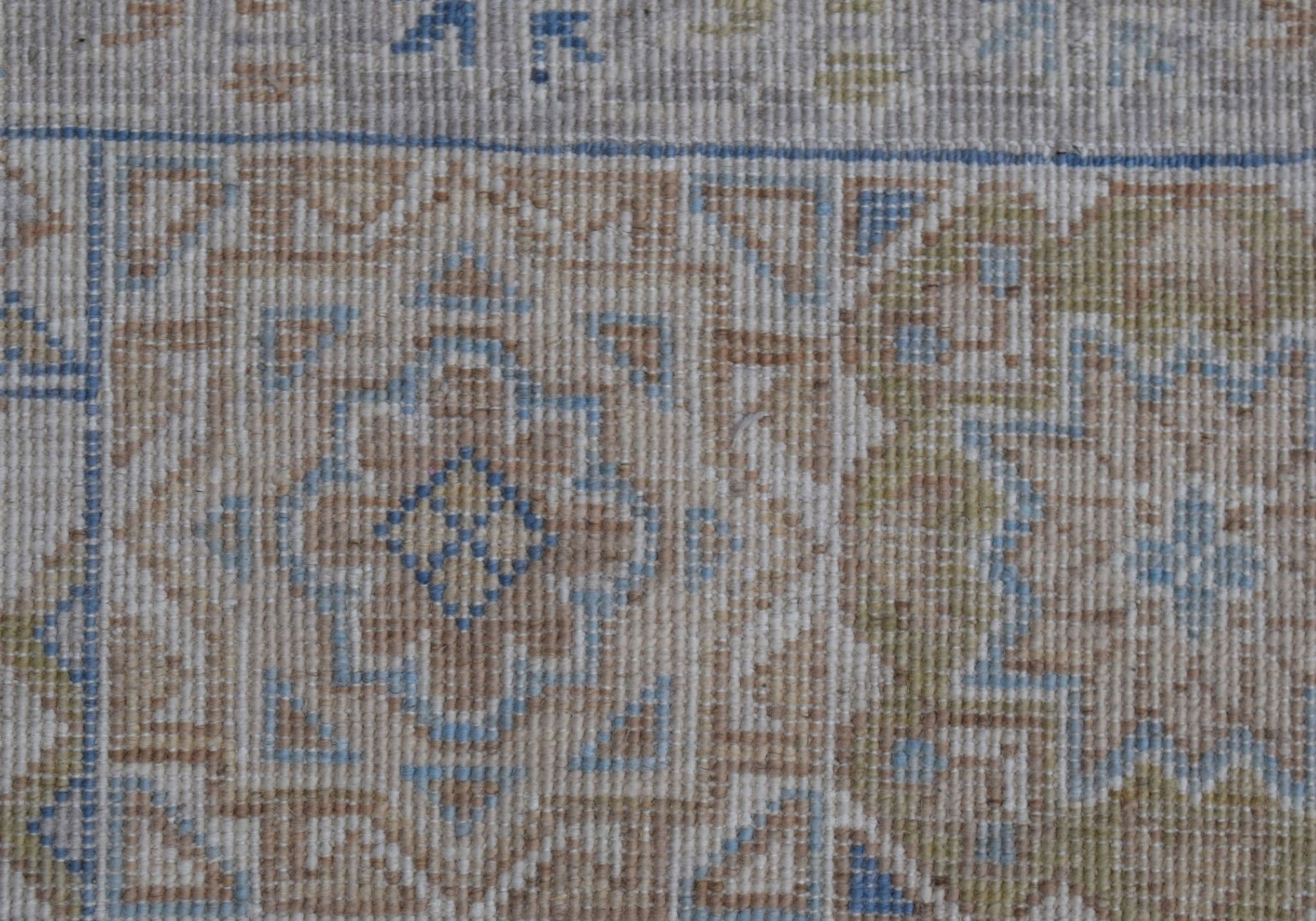 A close-up of a handwoven Afghan Chobi rug featuring a traditional Mamluk medallion pattern.