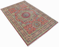 Handwoven Afghan Chobi rug featuring a traditional Mamluk medallion pattern in red and gold tones.