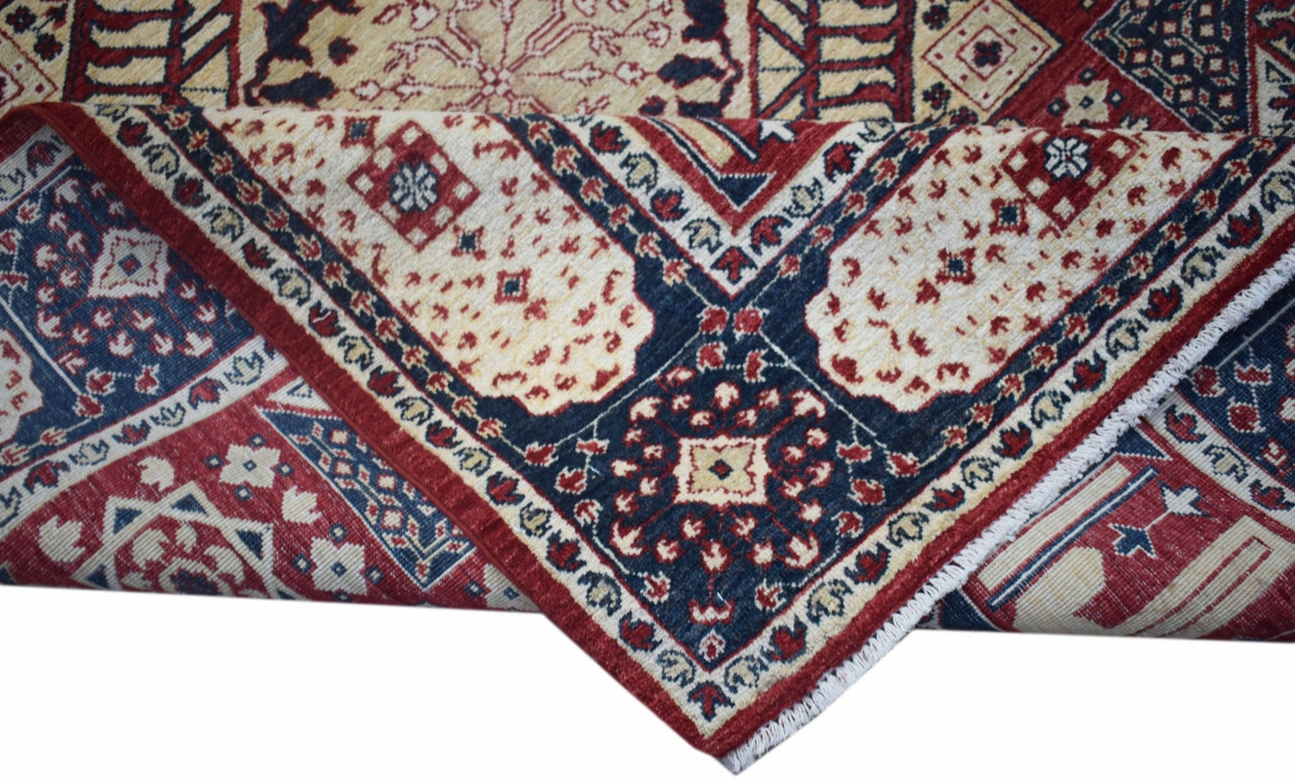 A handwoven Afghan Chobi rug featuring a traditional Mamluk pattern in red, blue, and cream tones.
