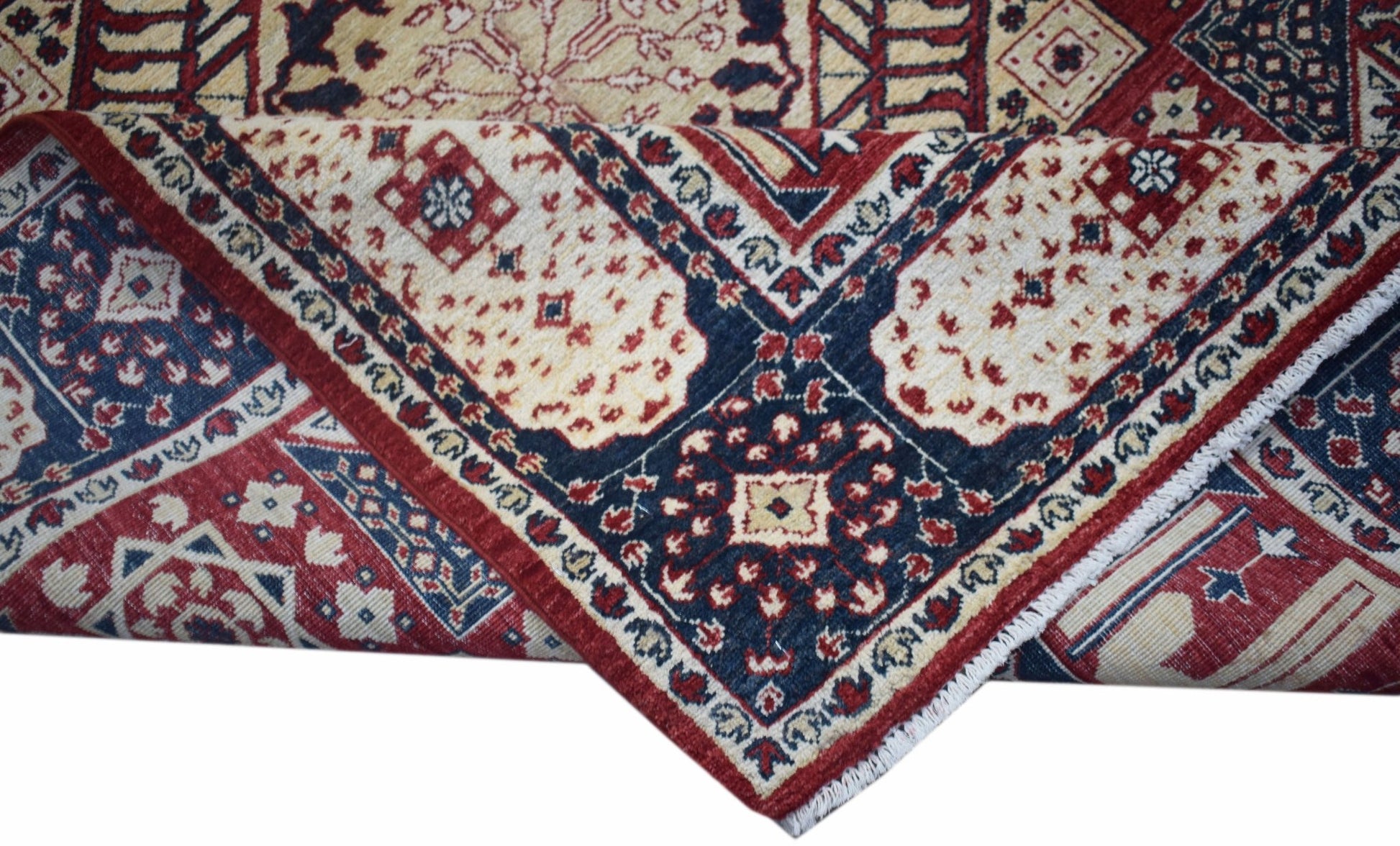 A handwoven Afghan Chobi rug featuring a traditional Mamluk pattern in red, blue, and cream tones.