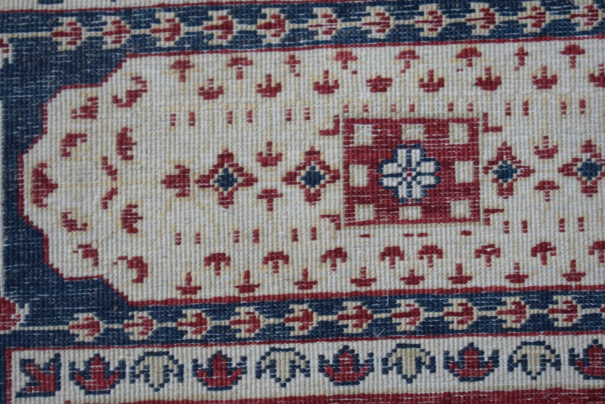 A handmade Afghan Chobi rug featuring a traditional Mamluk medallion pattern in red and blue.