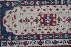 A handmade Afghan Chobi rug featuring a traditional Mamluk medallion pattern in red and blue.