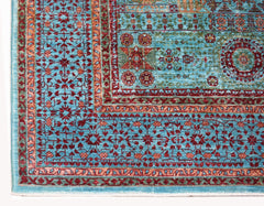 A handwoven Afghan Chobi rug featuring a detailed Mamluk pattern in shades of blue and red.