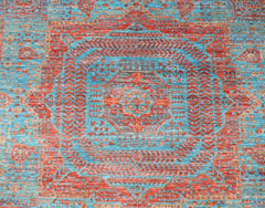 Handwoven Afghan Chobi rug featuring a detailed red Mamluk medallion on a vibrant blue background.