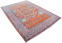 An Afghan Chobi rug featuring a Mamluk-inspired geometric pattern in orange and blue tones.