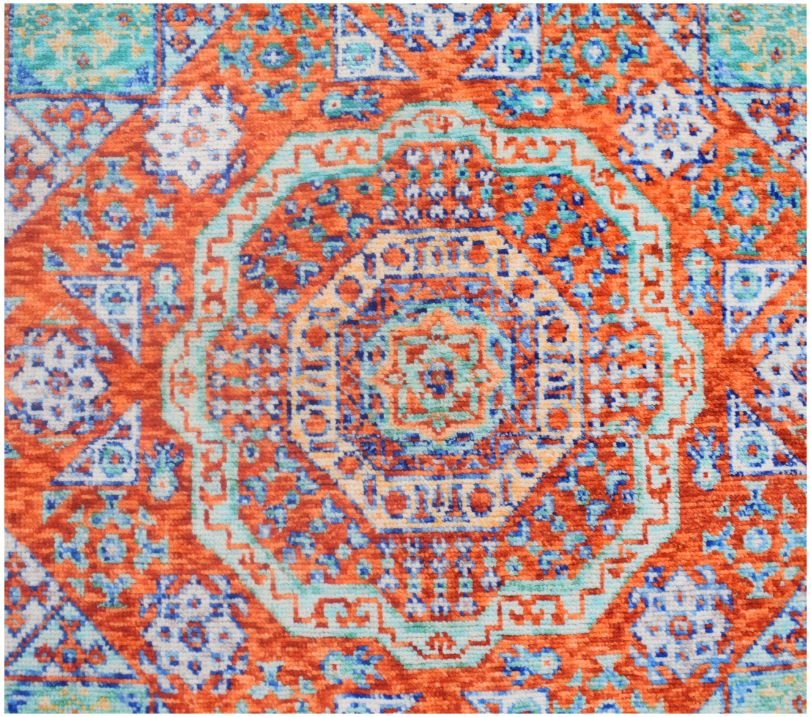 A handmade Afghan Chobi rug featuring a traditional Mamluk geometric pattern in orange and blue.