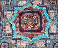 Handwoven Afghan Chobi rug featuring a detailed Mamluk medallion in shades of blue and red.