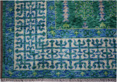 A handmade Afghan Chobi rug featuring a geometric Mamluk pattern in shades of blue and green.