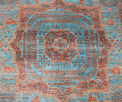 Handwoven Afghan Chobi rug featuring a detailed Mamluk medallion pattern in teal and rust tones.