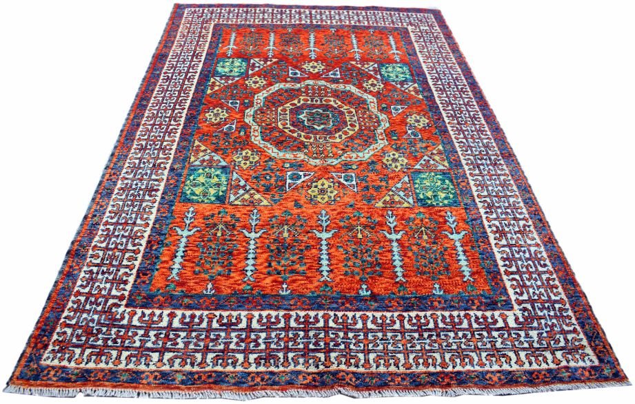 Handmade Afghan Chobi rug featuring a central medallion and geometric patterns on a red background.