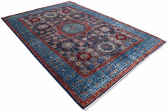A handmade Afghan Chobi rug featuring a traditional Mamluk medallion design in blue and red wool.