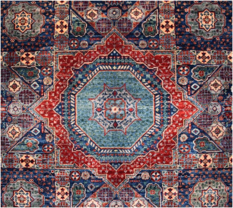 Handmade Afghan Chobi rug featuring a central geometric medallion in blue and red tones.
