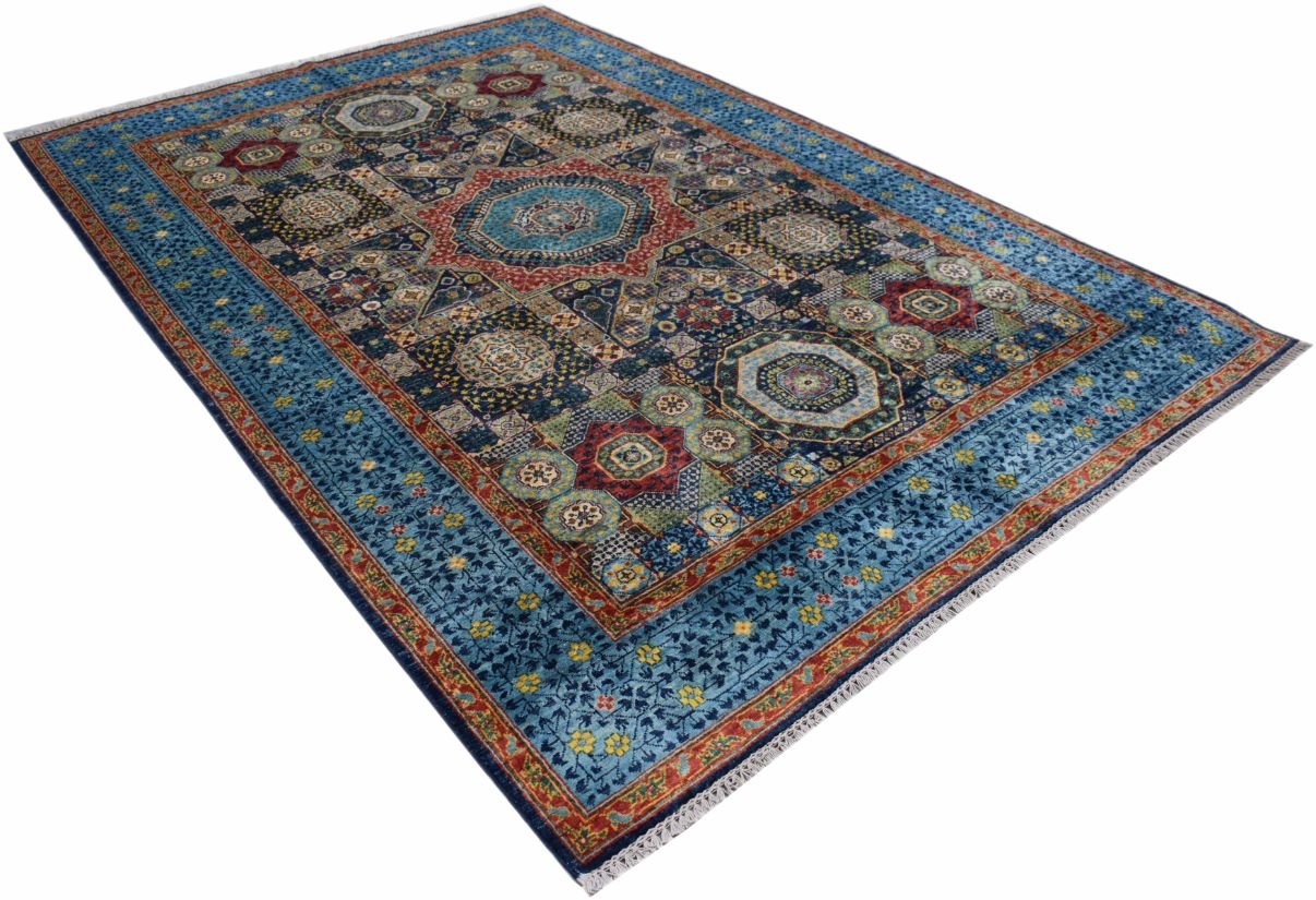 A rectangular Afghan Chobi Mamluk rug featuring intricate geometric medallions in blue and red.