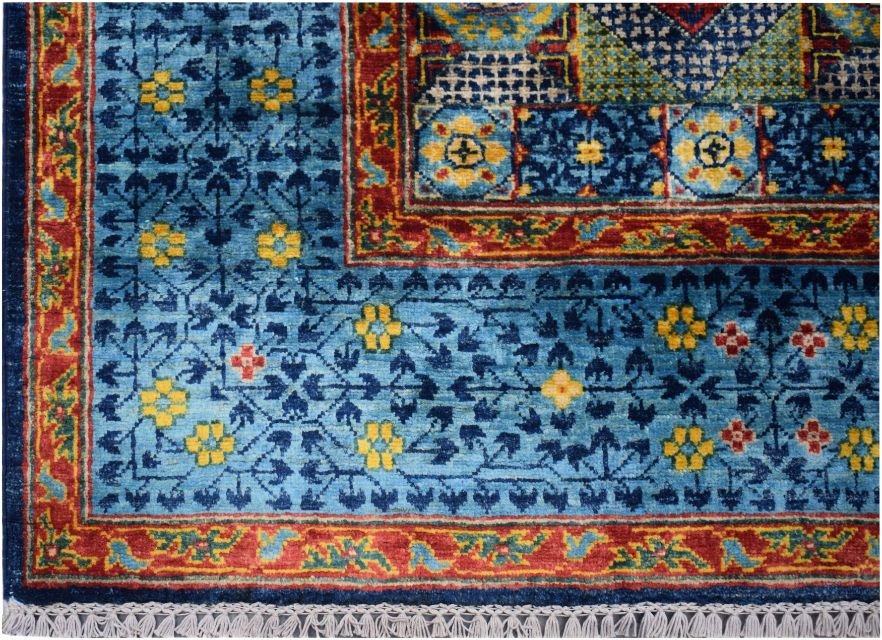A handmade Afghan Chobi rug featuring a blue field with yellow floral motifs and a red border.