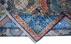 A handmade Afghan Chobi rug featuring a blue Mamluk medallion pattern with red and yellow accents.