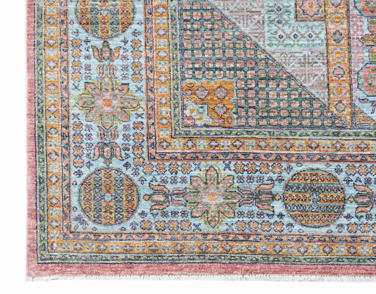 A handwoven Afghan Chobi rug featuring a traditional Mamluk geometric pattern in soft pastel tones.