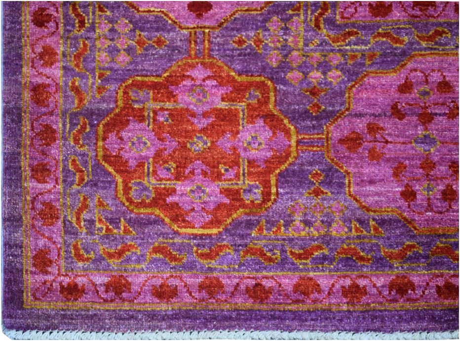 Handmade Afghan Chobi rug featuring a vibrant purple field with intricate red and pink medallions.