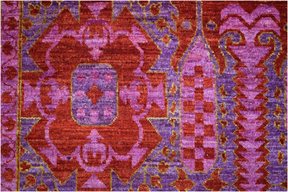A handmade Afghan Chobi rug featuring a complex Mamluk medallion design in shades of red and purple.