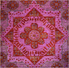 Handmade Afghan Chobi rug featuring a complex geometric medallion in shades of red and purple.