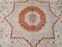 An Afghan Chobi rug featuring a detailed Mamluk medallion pattern in rust and soft purple tones.