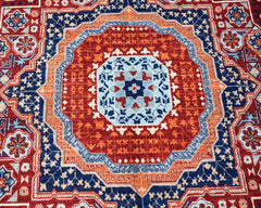 Handwoven Afghan Chobi rug featuring a detailed Mamluk medallion in red, blue, and orange tones.