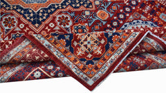 A handwoven Afghan Chobi rug featuring a complex Mamluk medallion pattern in red, blue, and cream.