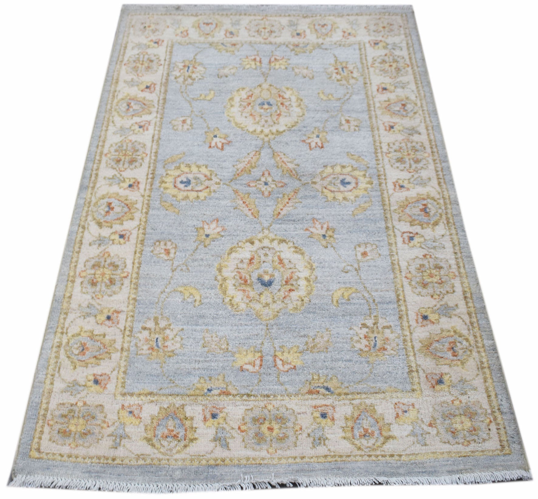 A rectangular Afghan Chobi rug featuring a traditional floral pattern in soft blue and beige tones.