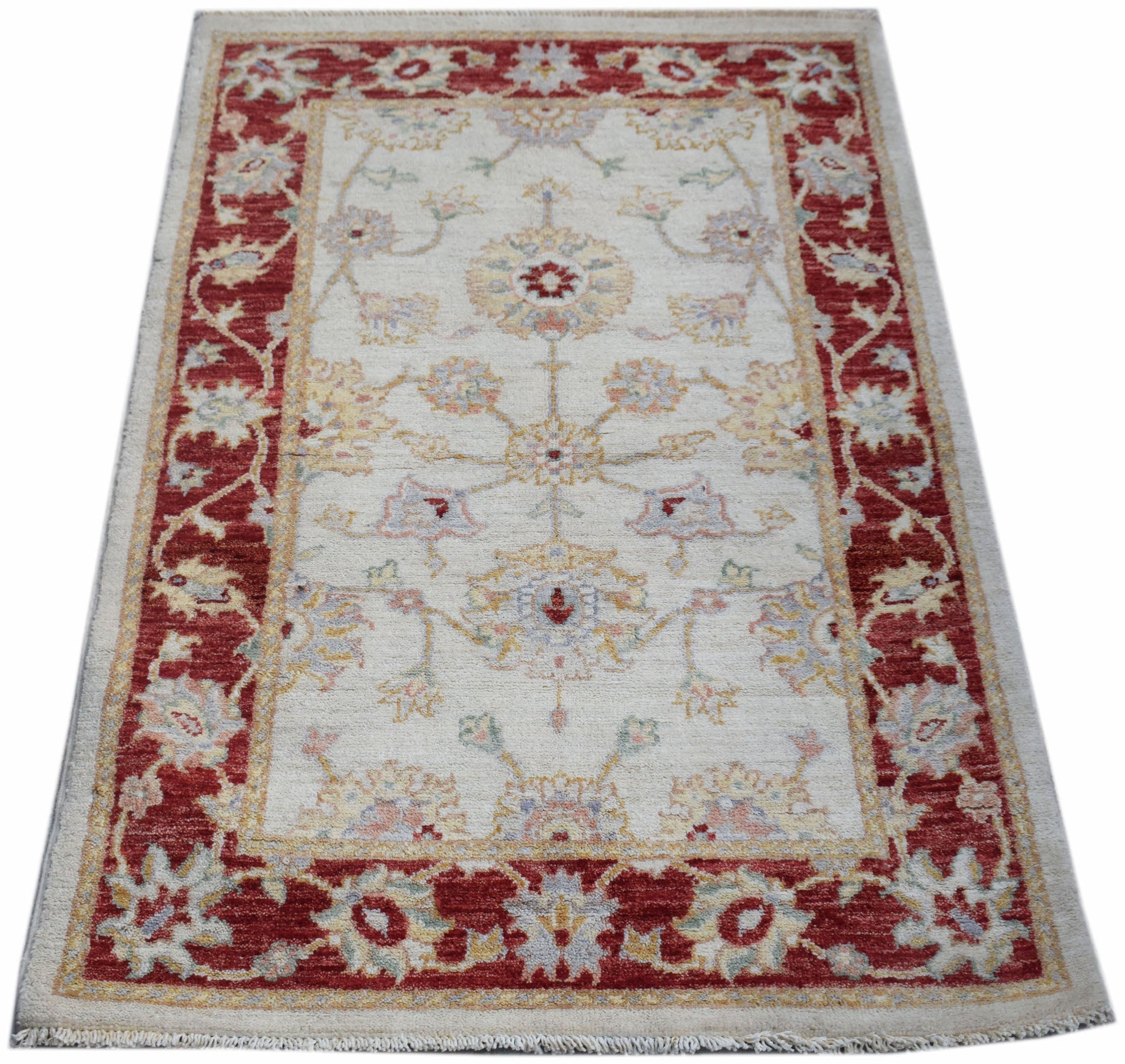 A rectangular Afghan Chobi rug featuring a cream field with floral motifs and a red border.