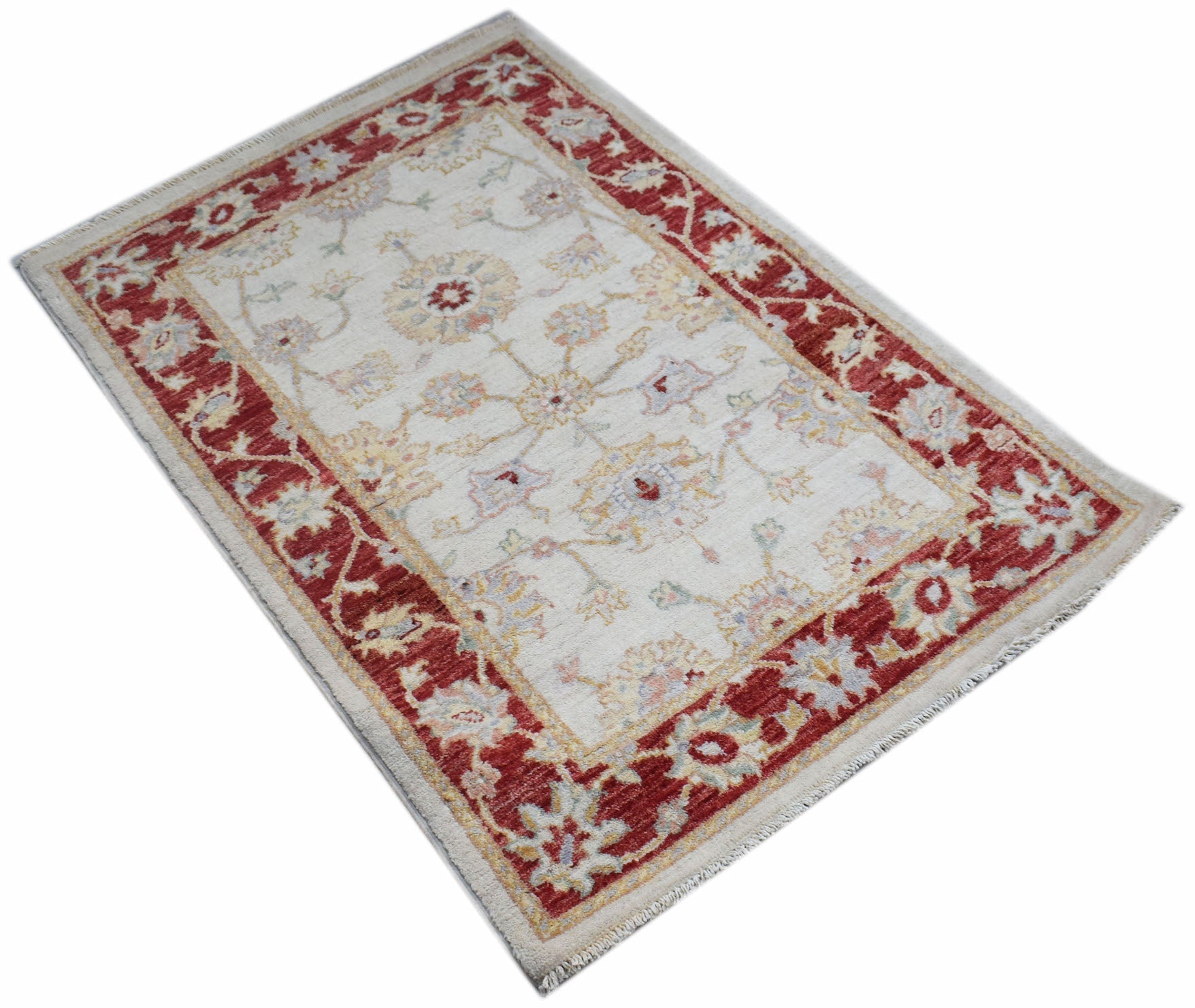 A rectangular Afghan Chobi rug featuring a cream field with floral motifs and a red border.