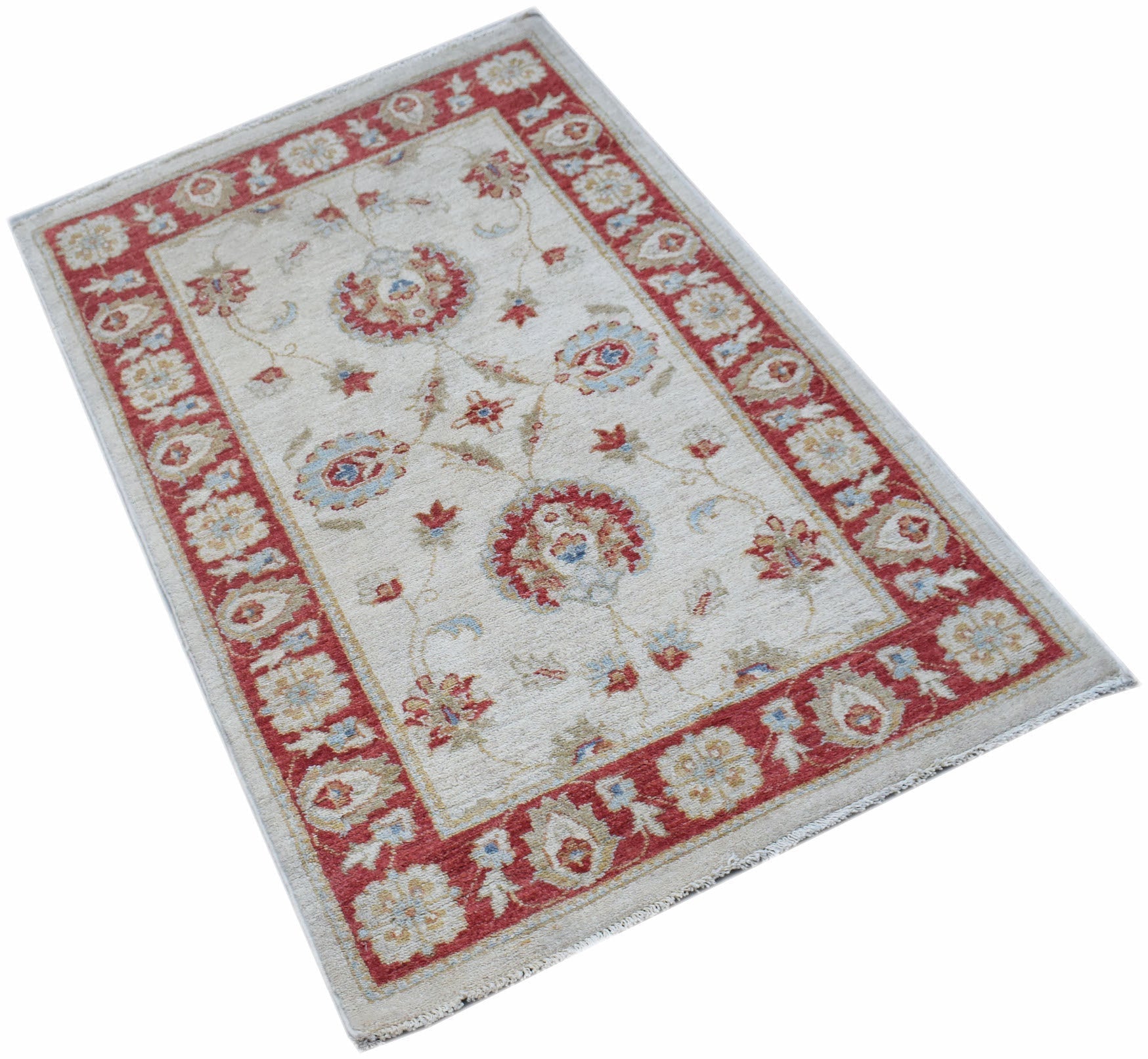 A rectangular Afghan Chobi rug featuring a floral pattern in red and beige tones.