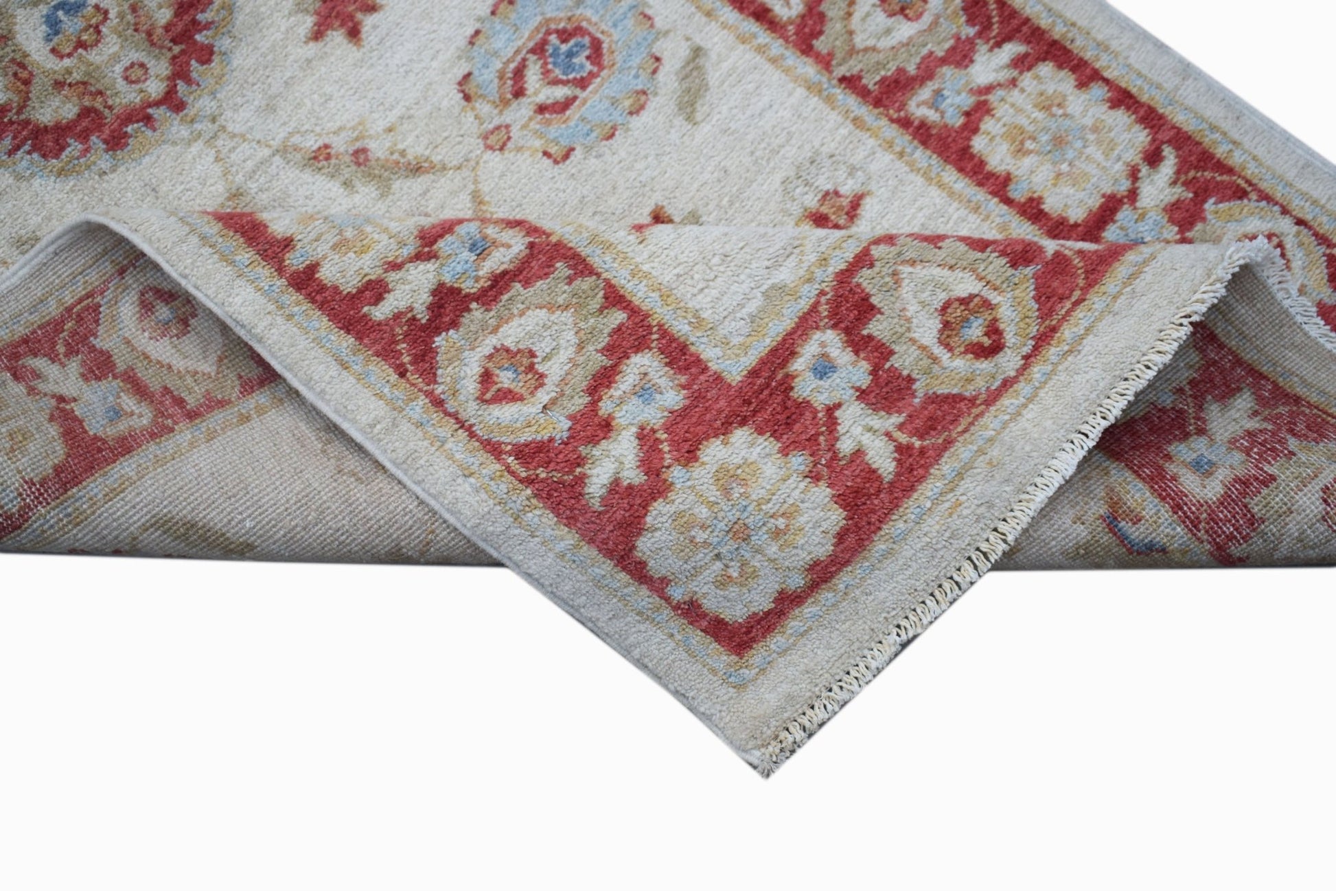 A handwoven Afghan Chobi rug featuring a traditional floral pattern in red, beige, and blue.