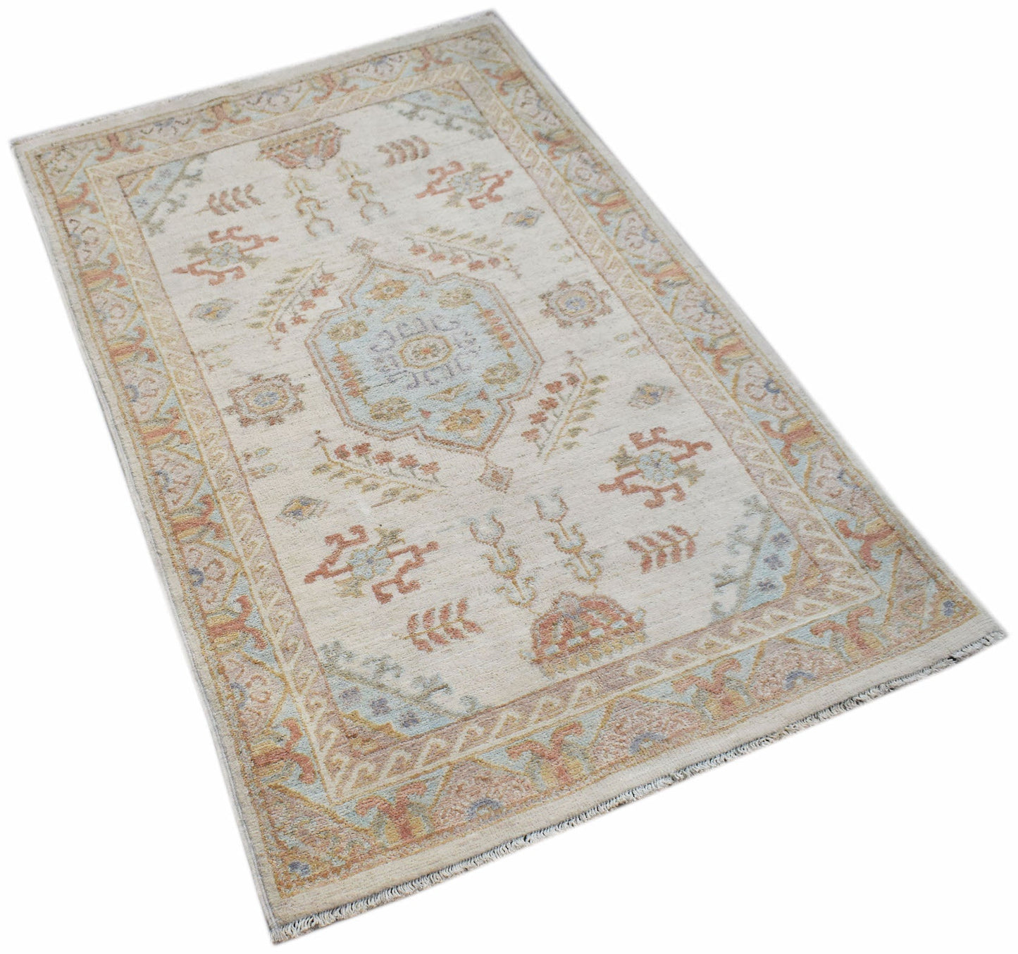 An Afghan Chobi rug featuring a central medallion and traditional floral motifs in soft earth tones.