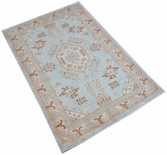 A rectangular Afghan Chobi rug featuring a light blue field with traditional geometric patterns.