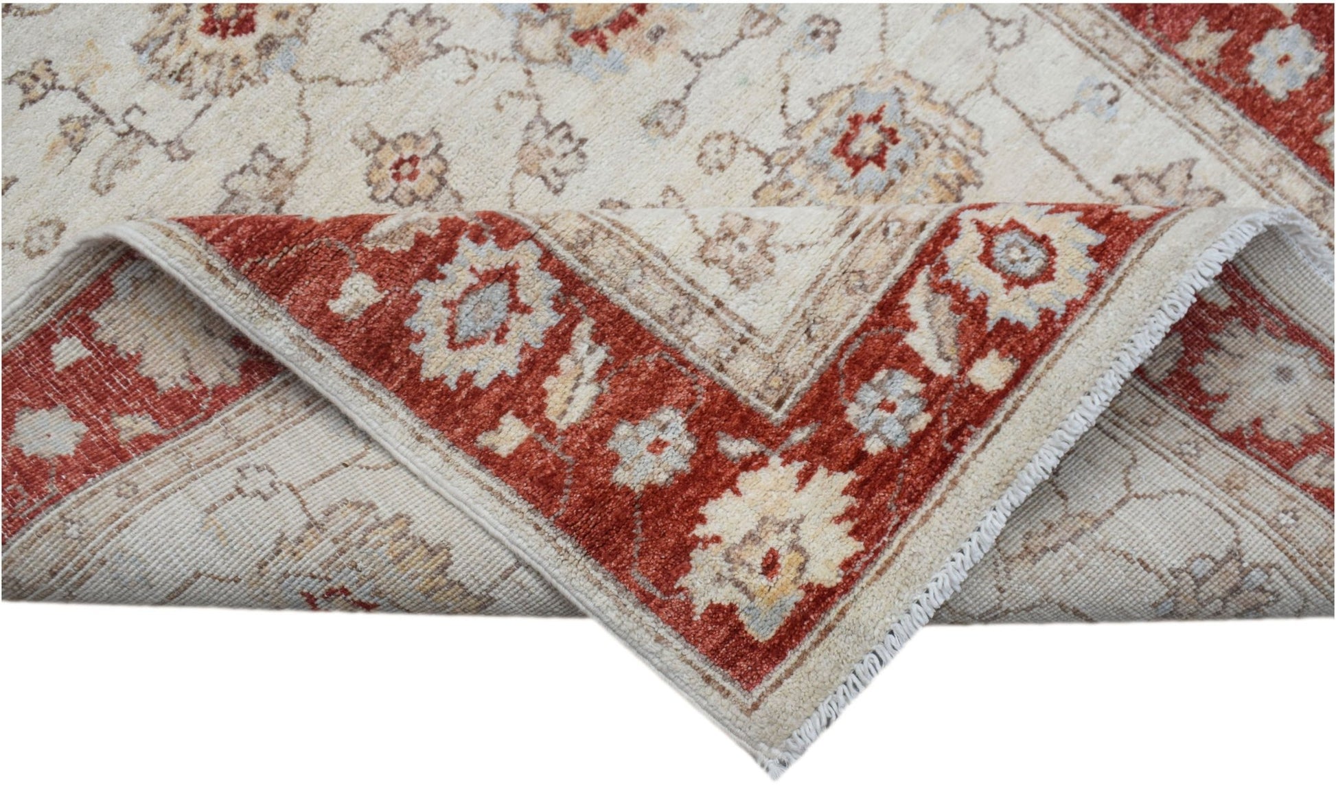 A handwoven Afghan Chobi rug featuring a traditional floral pattern in red and beige tones.
