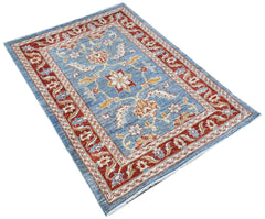 A rectangular Afghan Chobi rug featuring a traditional floral pattern in blue, red, and cream.