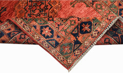 A handwoven Afghan Chobi rug featuring traditional geometric patterns in red, blue, and green.