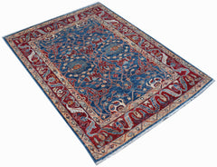A rectangular Afghan Chobi rug featuring a traditional floral pattern in blue and red tones.