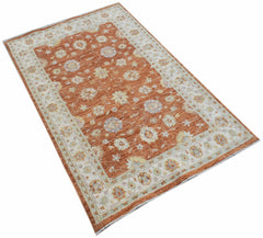 A rectangular Afghan Chobi rug featuring a floral pattern in shades of orange, cream, and blue.