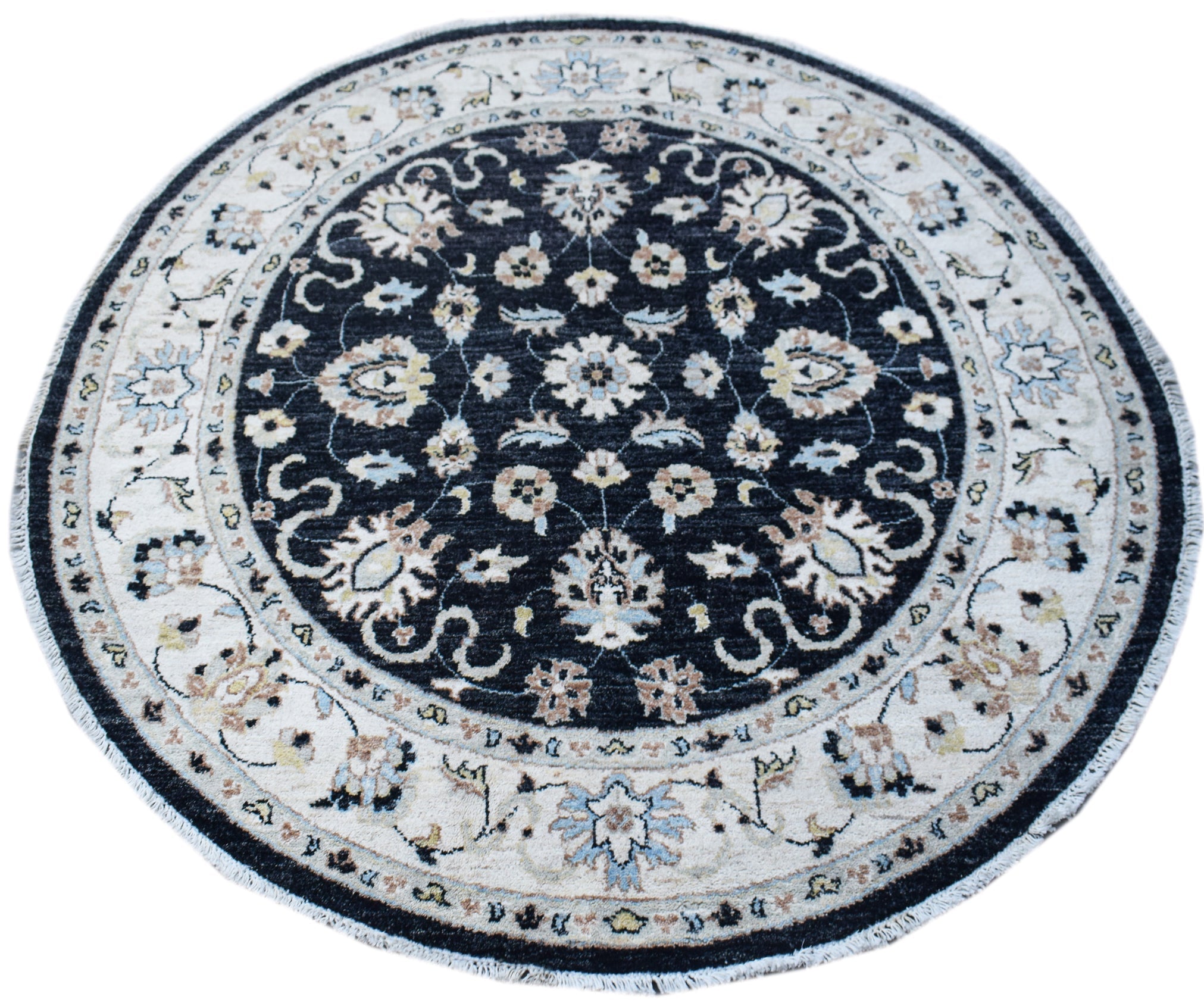 A round, handwoven Afghan Chobi rug featuring a dark central medallion with intricate floral motifs.
