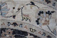 A close-up of a handwoven Afghan Chobi rug featuring intricate floral patterns in earthy tones.