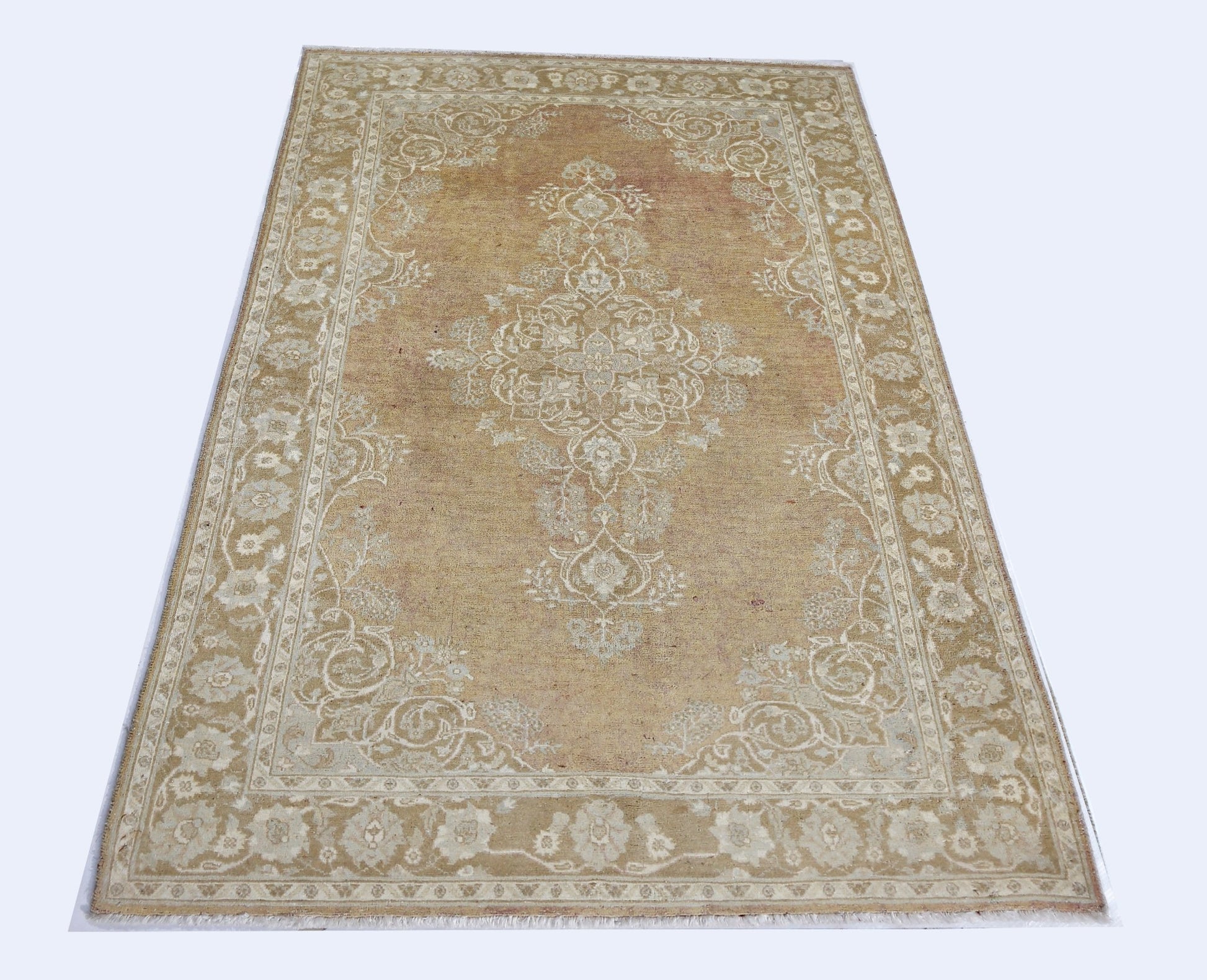A rectangular Afghan Chobi rug featuring a traditional floral medallion in shades of tan and cream.
