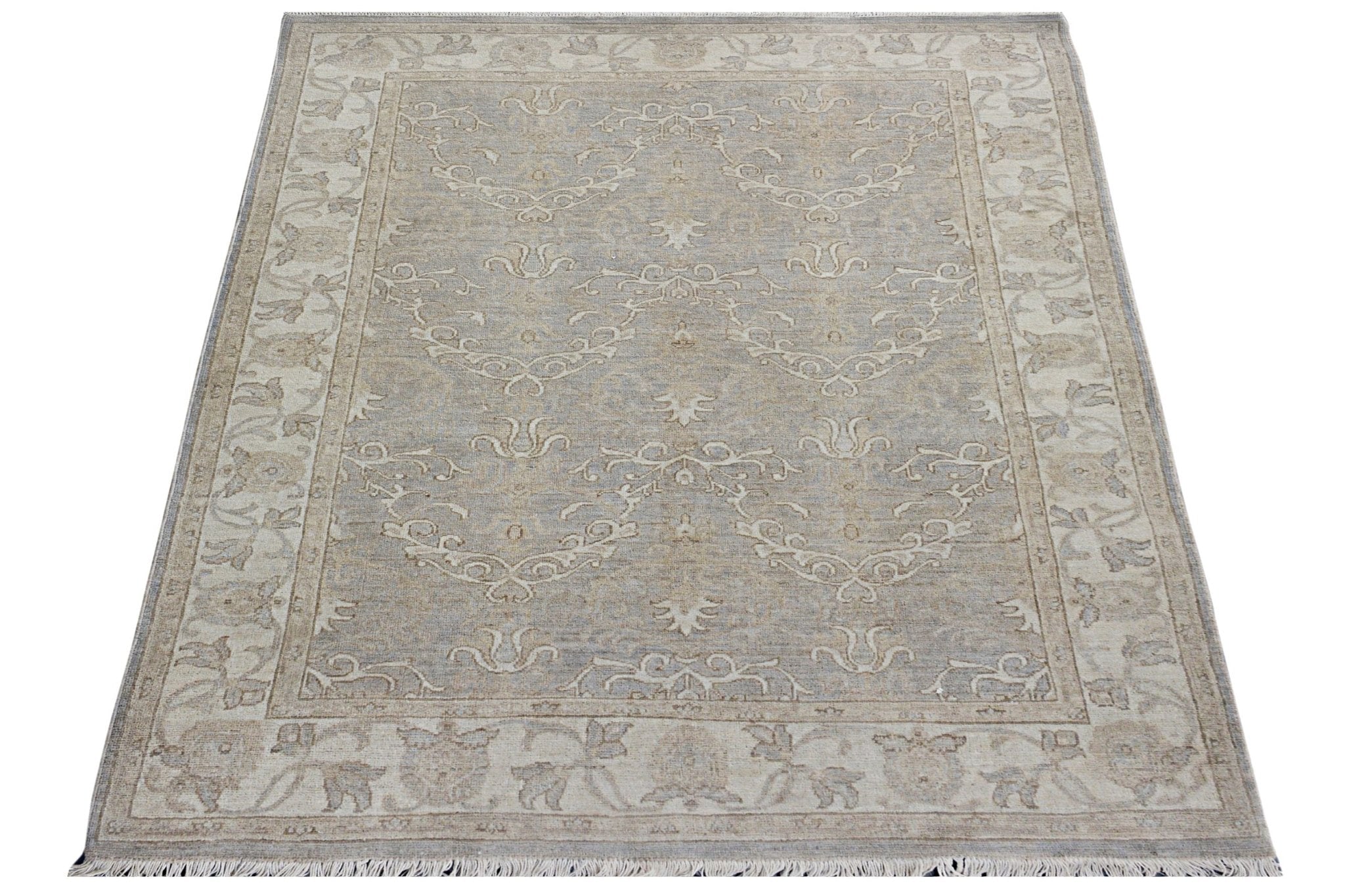 A rectangular Afghan Chobi rug featuring a traditional beige and grey floral pattern.